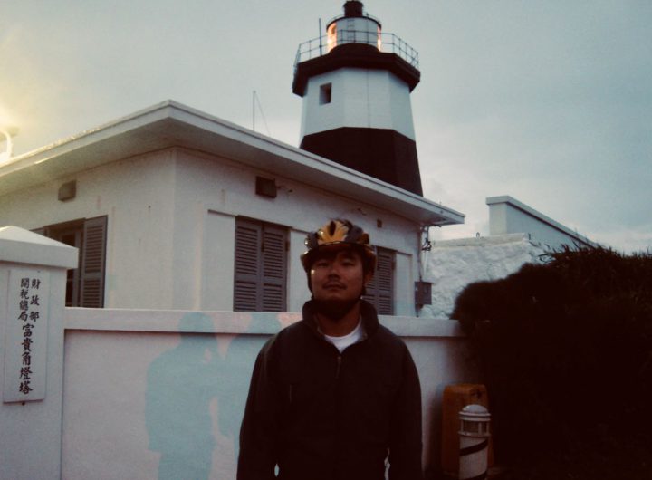 Cyclist in front of a Light House