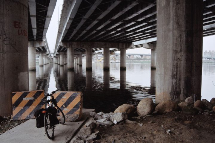A bike and bridge columns
